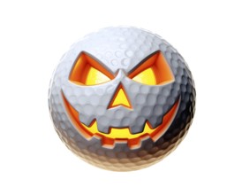 Jack-o-lantern golf ball with carved evil face with glowing orange light inside, for Halloween