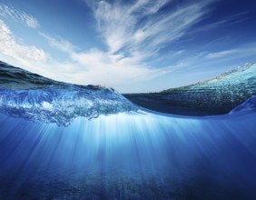 Water wave under blue sky. . Water wave with bubbles, AI generated