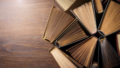 Old books arranged highlighting their historical significance. Neatly arranged representing a