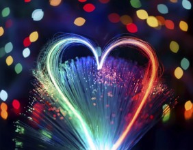 Colorful artistic display featuring vibrant light patterns shaped like a heart, expressing love and