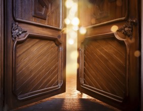 Vintage door ajar in the middle with glowing magical warm lights on the other side, AI generated