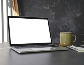 Laptop computer placed on an office desk concept image representing workspace, digital technology,