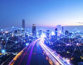 A futuristic smart city skyline illuminated with neon lights, symbolizing technology, innovation,