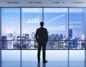 A businessman reviewing financial data on digital screen, representing investment planning,