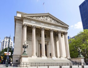 Bank building facade with classical columns, symbolizing finance, economic stability, investment