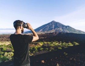 A VR headset user immersed in gaming and metaverse, representing digital entertainment,