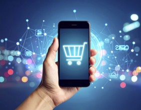 Hand holding smartphone glowing shopping cart icon poster symbolizing online shopping, e-commerce,