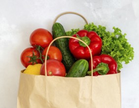 Fresh vegetables and fruits in reusable eco bag, symbolizing sustainability, healthy eating, zero