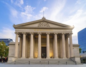Bank building facade with classical columns, symbolizing finance, economic stability, investment
