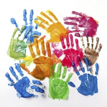 Vibrant multicolored handprints on white background, symbolizing creativity, playful expression,