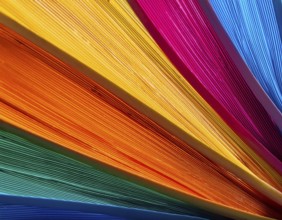 Multi color background bursting with vivid tones, artistic expression, and modern abstract design