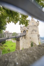 View through an opening onto a bridge leading to a castle, Lichtenstein Castle, Lichtenstein,