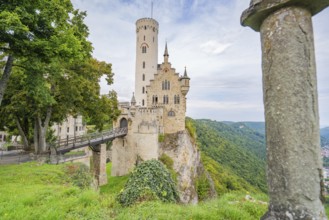 Castle majestically enthroned on a cliff, surrounded by green forest, Lichtenstein Castle,