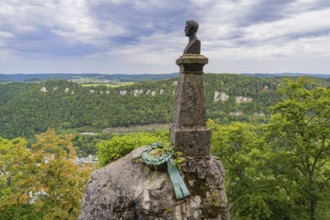 Bust on a rock with a view of the wide landscape and cloudy sky, Lichtenstein Castle, Lichtenstein,