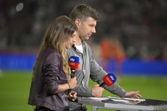 SKY presenter Mara Mones in an interview Microphone Logo with TV expert Thomas Hitzlsperger German