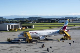 Passengers boarding an Airbus A320-214 of the airline Eurowings at Salzburg Airport, Austria