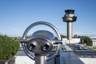 Binoculars for visitors aimed at the tower of Salzburg Airport, Austria