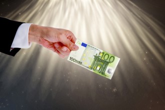 Symbolic image, hand reaches out 100-euro note, purchasing power, stable currency, currency war,
