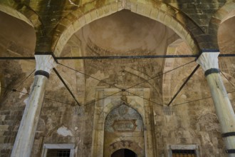 Interior with antique arcades and stone decorations in a historic building, Recep Pasha Mosque, Old