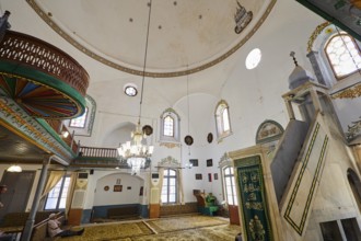 Magnificent mosque interior with chandelier and prayer rugs, Ibrahim Pasha Mosque, Old Town,