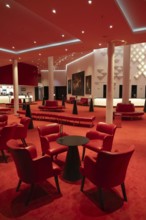 View into the illuminated foye of the theatre on the Elbe, Hamburg, Germany
