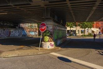 View of parts of a road leading under the Oberhafen Bridge and of the abutment painted with