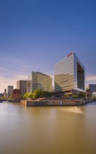 Photograph of light reflections on the water surface from a long exposure and the mirror building