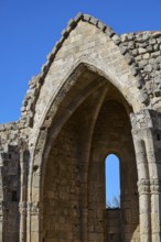 Church of Virgin Mary of the Castle, detailed view of a Gothic ruin with a striking window under a