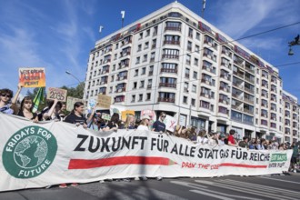 Demonstrators with front banner Future for all instead of gas for the rich on Friedrichstraße at