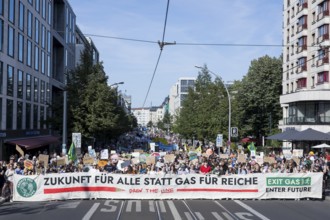 Demonstrators with front banner Future for all instead of gas for the rich on Friedrichstraße at