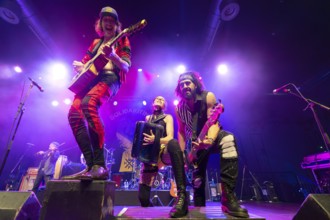 Eugene Hütz, left, singer and guitarist, Gogol Bordello, folk-punk band, USA, live on Fall 2025