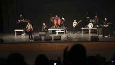 Turkish singer Coskun Sabah performs on stage at Gaziantep University as part of the Türkiye Kültür