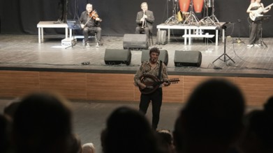 Turkish singer Coskun Sabah performs on stage at Gaziantep University as part of the Türkiye Kültür