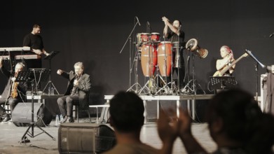Musicians play on stage alongside Turkish singer Coskun Sabah during the Türkiye Kültür Yolu