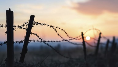 Silhouette Of Barbed Wire And Wooden Stake On The Ground: Elements Of Trench Warfare Depicted In