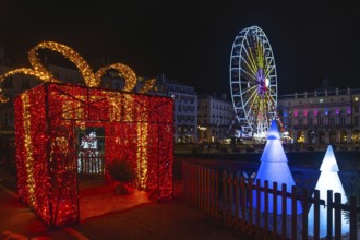 Festive christmas decorations illuminating bayonne's city center at night, creating a magical