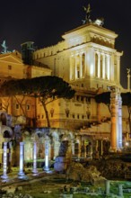 View at night over the Caesar Forum of Julius Caesar, illuminated in colour from the front, with