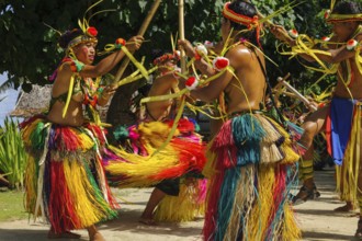Traditional group of dancers from Yap Island dancing in historical traditional costume with