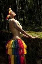 Young woman in traditional traditional costume enjoying the sun, Yap Island, Yap State, Caroline