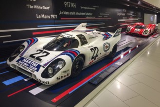 In the front, historic Porsche 917 No. 22 racing car with magnesium cage by racing driver Dr Helmut