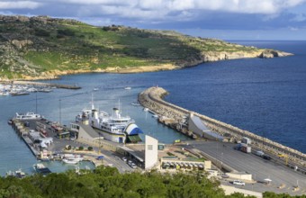View of jetty for ferries from to Valletta island Malta and moored ferry car ferry, on the right