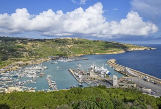 View of Gozo Mgarr Harbour harbour basin with small boats yachts yachts on the left, in the centre