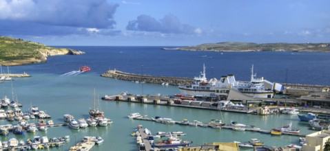 View of harbour basin of Gozo Mgarr Harbour with small boats yachts yachts, in the middle of the