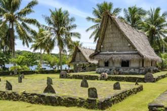 Traditional houses in museum village of Yap Island in front of dance area wonbey for traditional