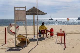 The Praia de São Roque beach, east of Lagos town centre, quite empty, lifeguards on duty,