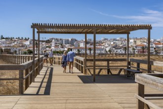 The skyline of the historic centre of Lagos, on the river Bensafrim, view from the boardwalk on the