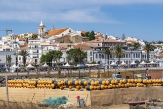 The skyline of the old town of Lagos, on the river Bensafrim, harbour channel, in the west of the