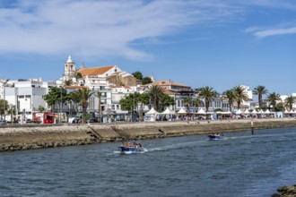 The skyline of the old town of Lagos, on the river Bensafrim, harbour channel, in the west of the