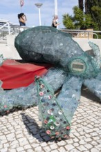 Figure of an octopus, filled with PET bottles, plastic products, reminder not to produce so much