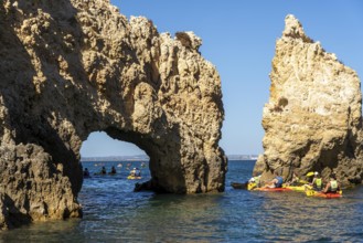 Tour with sea kayaks to the Ponta da Piedade rocky coast, rugged coastal landscape, right next to
